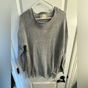 Gray long sleeve sweater with tie accents on the side